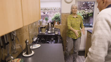 elderly couple in a kitchen