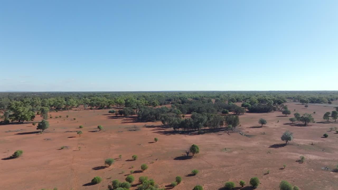 Aerial: Drone shot over sheep station land in the Australian outback near Bourke