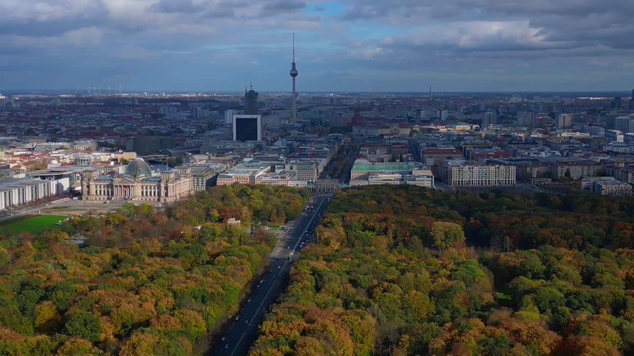 Berlin cityscape from Tiergarten park to Reichstag, Brandenburg Gate and Tv Tower. Nice aerial view flight descending drone