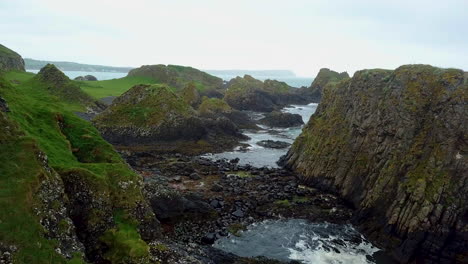 amazing revealing aerial view of rocky coastline in northern ireland