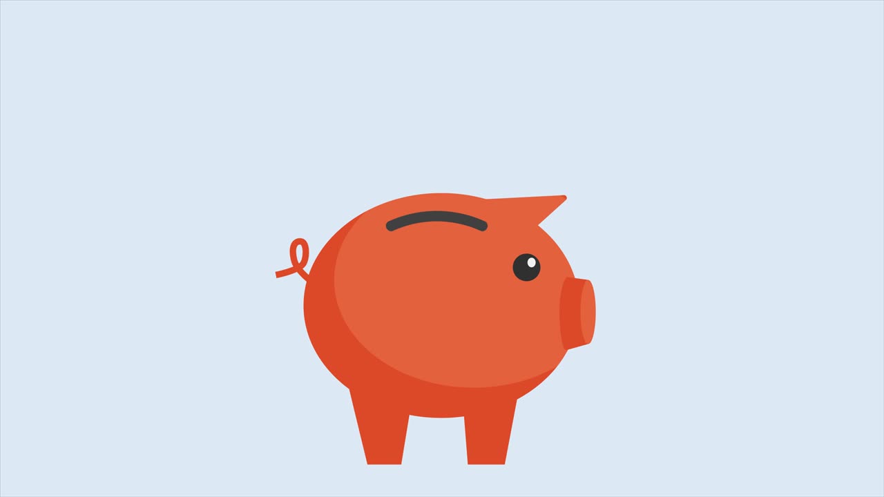 Gold coins fall in a piggy piggy bank