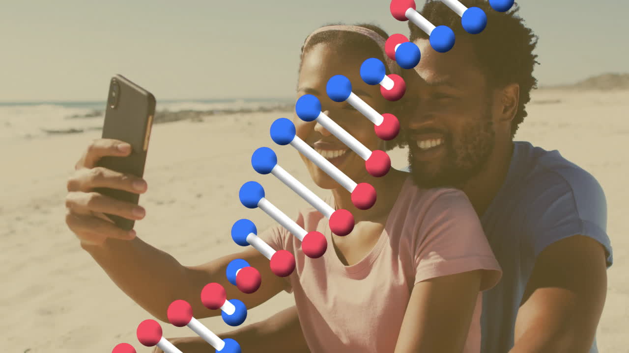 Couple taking selfie on beach with DNA strand animation overlay