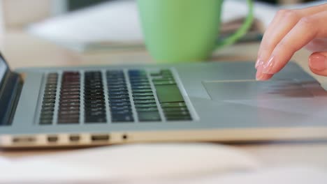 Woman-hands-using-touchpad-on-laptop-computer.-Corporate-business-people