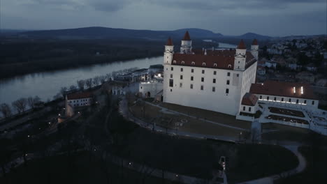 slow ascending aerial shot of bratislava castle at twilight