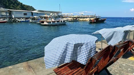 tables with umbrellas by the ocean in sorrento