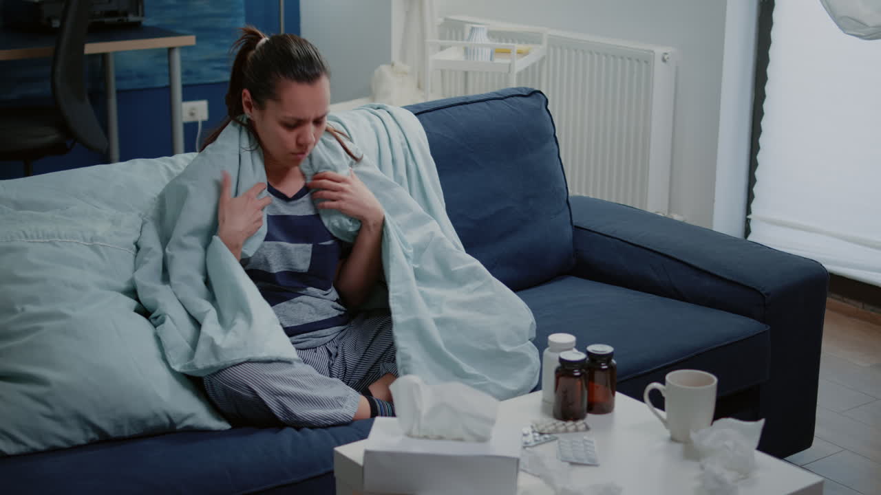 Adult with fever checking temperature with thermometer