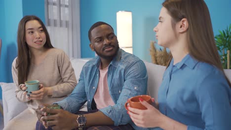 multiethnic group at home, chatting.