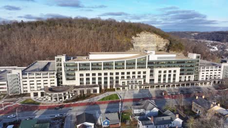 kentucky transportation cabinet building in frankfort during fall at sunset with dramatic shadows and orange colors aerial trucking pan