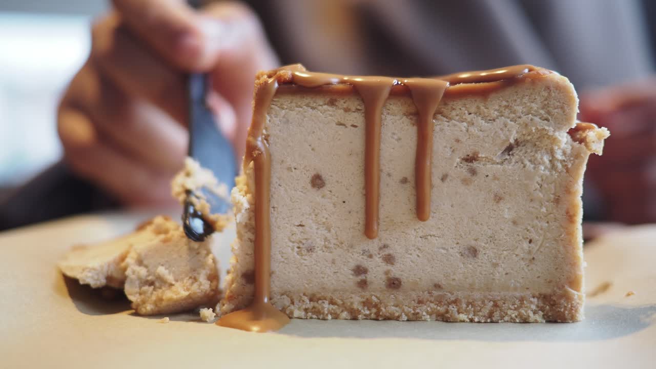 Close-up of Caramel Cheesecake Being Eaten with a Fork