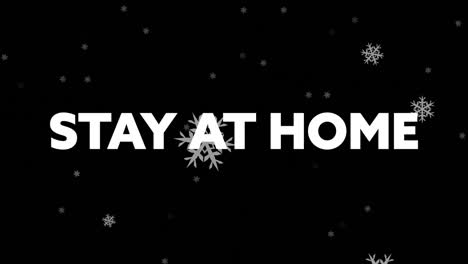 animation of stay at home text with winter scenery and snow falling on black background