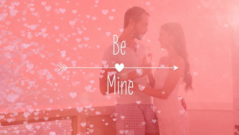 animation of be mine with a couple in love in black background