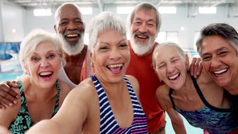 group selfie of seniors in a swimming pool
