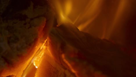 firewood burning in fireplace. extreme closeup shot