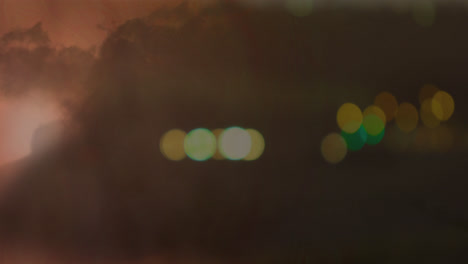 Transmission-tower-with-bokeh-lights-and-lightning-in-clouds