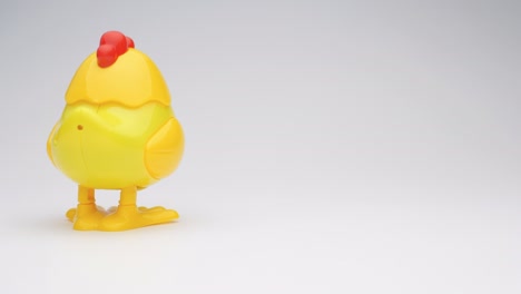 clockwork yellow toy chicken.
