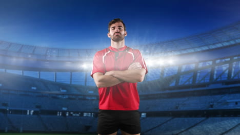 jugador de rugby profesional de pie frente a un estadio
