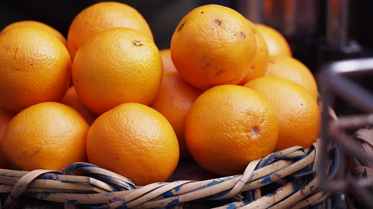 Pile of Fresh Oranges in a Basket
