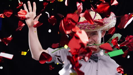 hombre con sombrero celebrando con una rosa y confeti