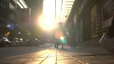 Low-Down-Shot-of-Sidewalk-at-Sunset