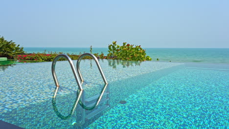 an empty swimming pool awaits swimmers