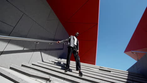 fashion models posing on modern urban stairs