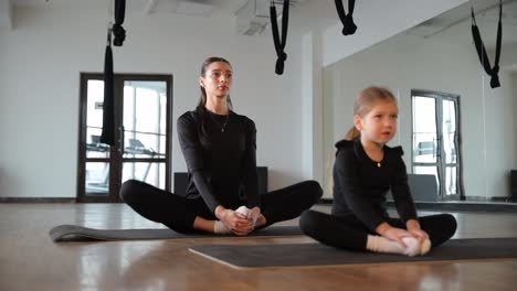 yoga instructor teaching a child