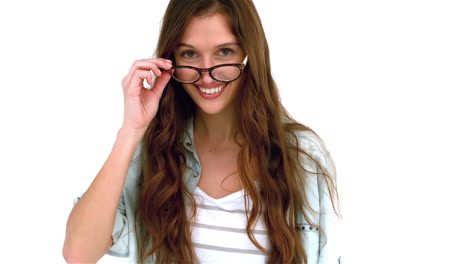 Smiling-woman-taking-off-eyeglasses