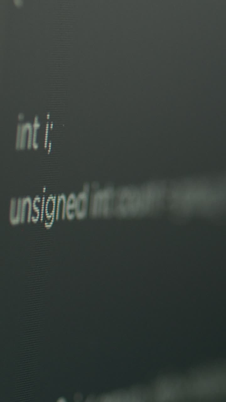 Vertical video: Program code on computer screen with software development database