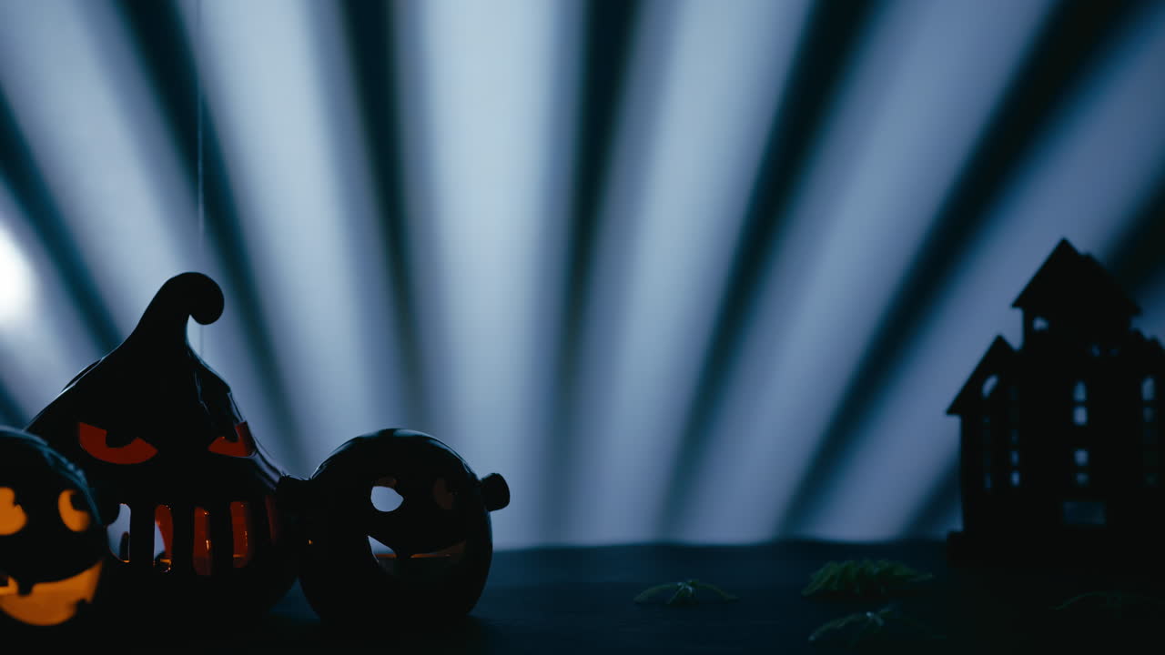 Halloween Pumpkins and Creepy Spiders on a Blue Background copy space