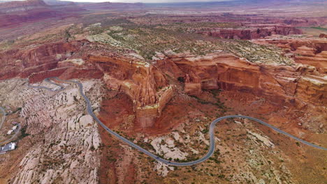Orange rocks in the tremendous Zion Canyon National park in USA. Cinematic aerial view over the road going around the hills.
