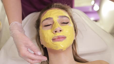 a woman is receiving a yellow face mask at the spa 4k 2025 08 04 21 56 49 utc.mov | aromatherapy, art, asian, bathroom