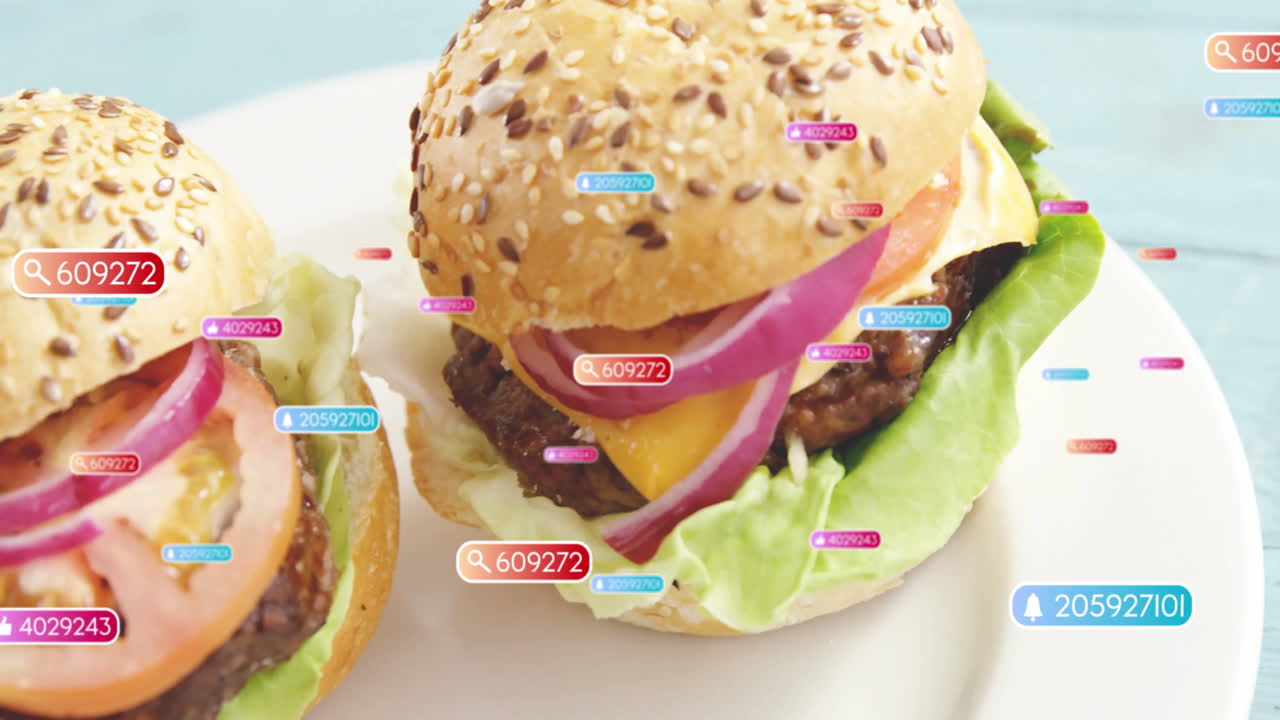 Colorful data tags overlaying animation of hamburgers with sesame seed buns