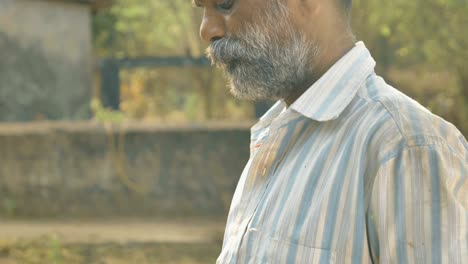 a working male or middle aged man using atm card by smartphone or mobile phone.