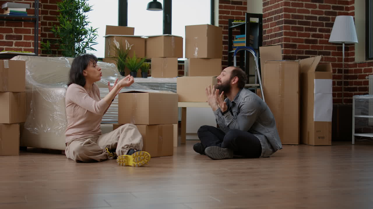 Angry couple having argument about new household decorations