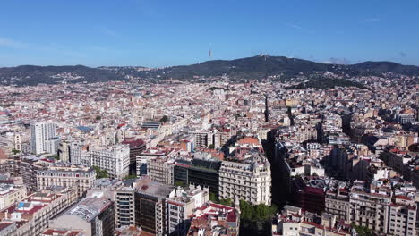 Aerial-Push-In-of-Dense-City-Center-of-Barcelona-on-a-Sunny-Day