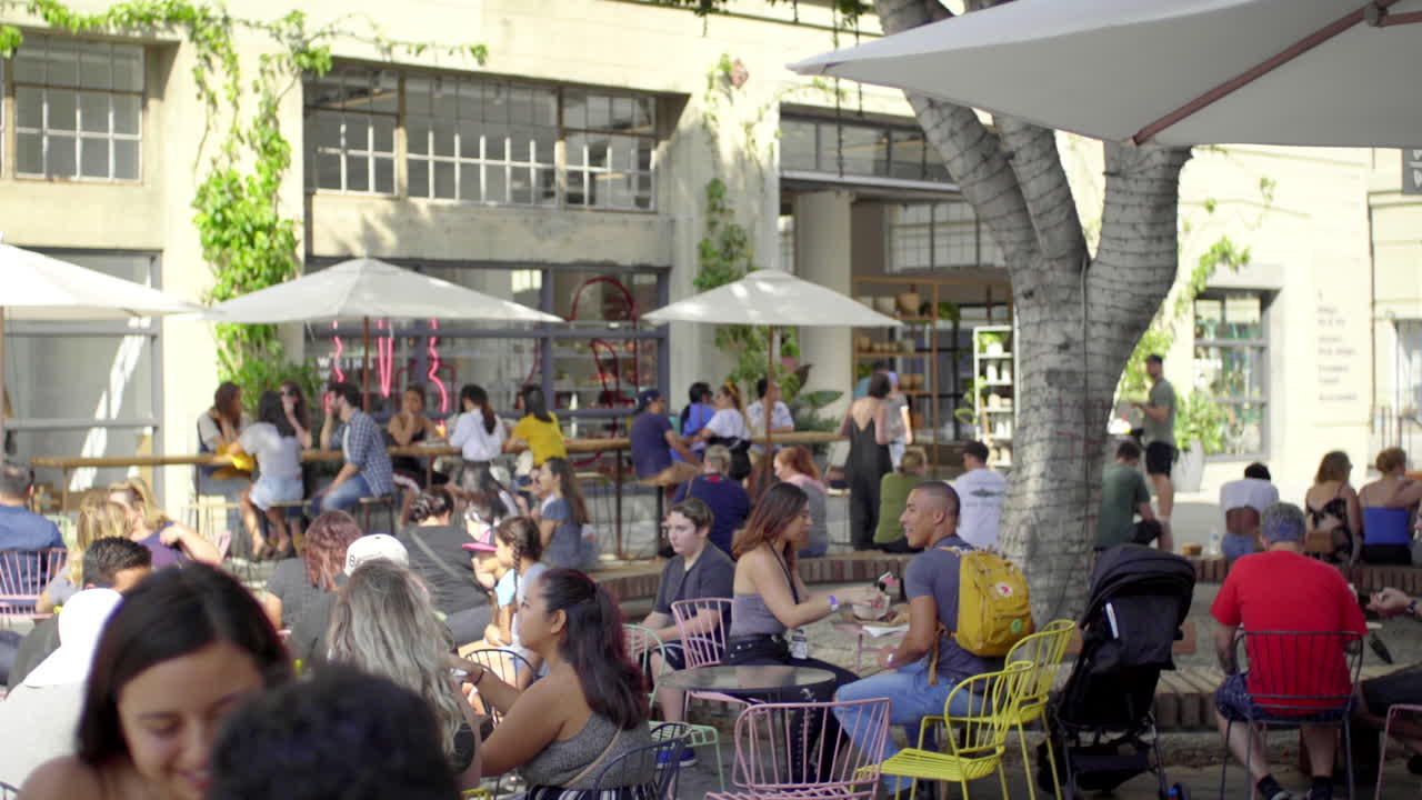 Lively Outdoor Cafe Patio with People Socializing