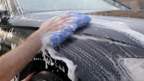 Washing-black-car-wing-fender