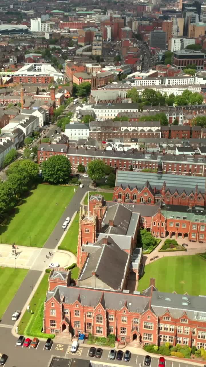 Side-on, overhead social ratio aerial video of Queen's University, Belfast on a bright and sunny day. Filmed in 1080x1920, 60fps and with Rec709 color