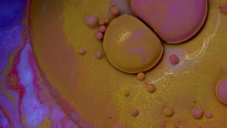 abstract colorful bubbles. macro color paint in dynamic flow. chaotic motion texture background. top view