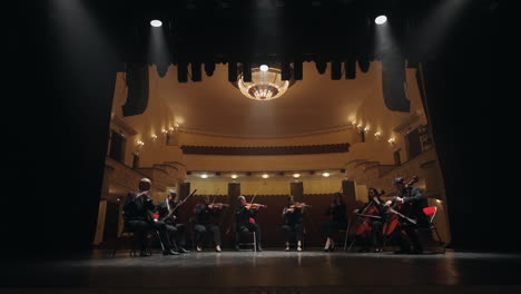 classic music orchestra is playing music on scene of old opera house beautiful concert hall