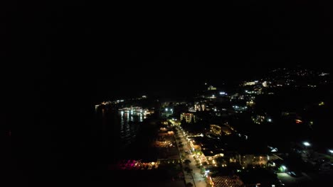 Dhermi-Beach-Promenade-Aglow:-Nighttime-Tranquility-and-Lights-by-the-Sea-for-a-Relaxing-Seaside-Stroll