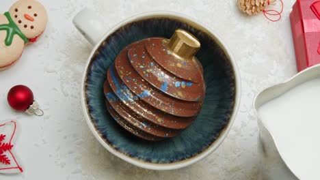 christmas chocolate ornament in a mug