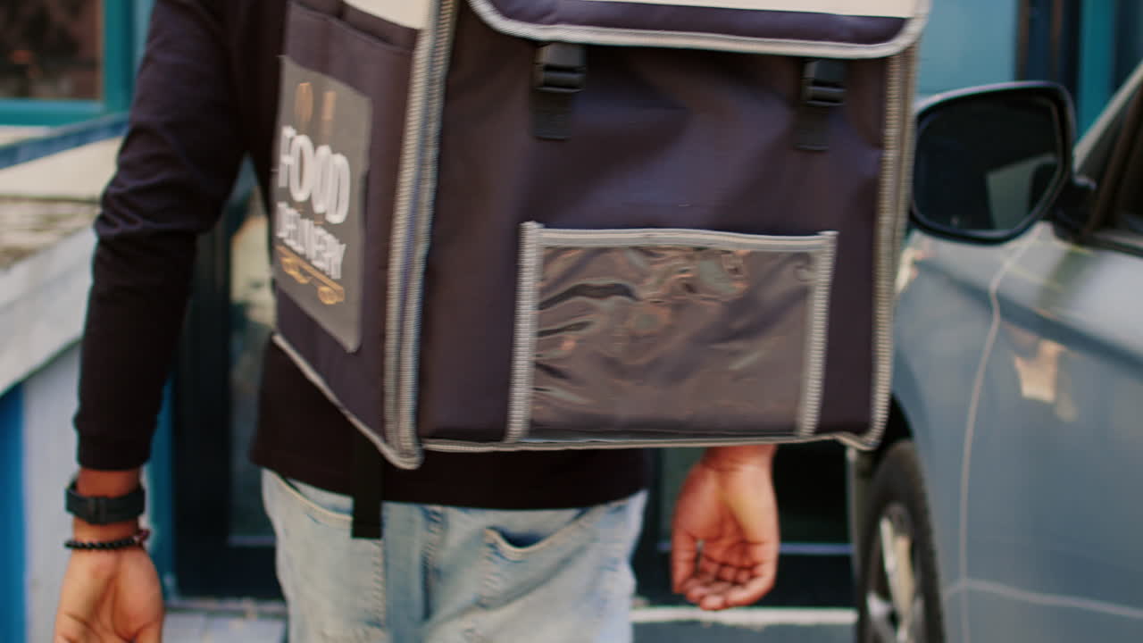 Delivery driver getting in car