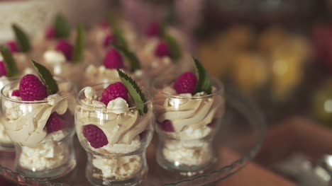 close up of sweets and cakes on table at wedding reception 2