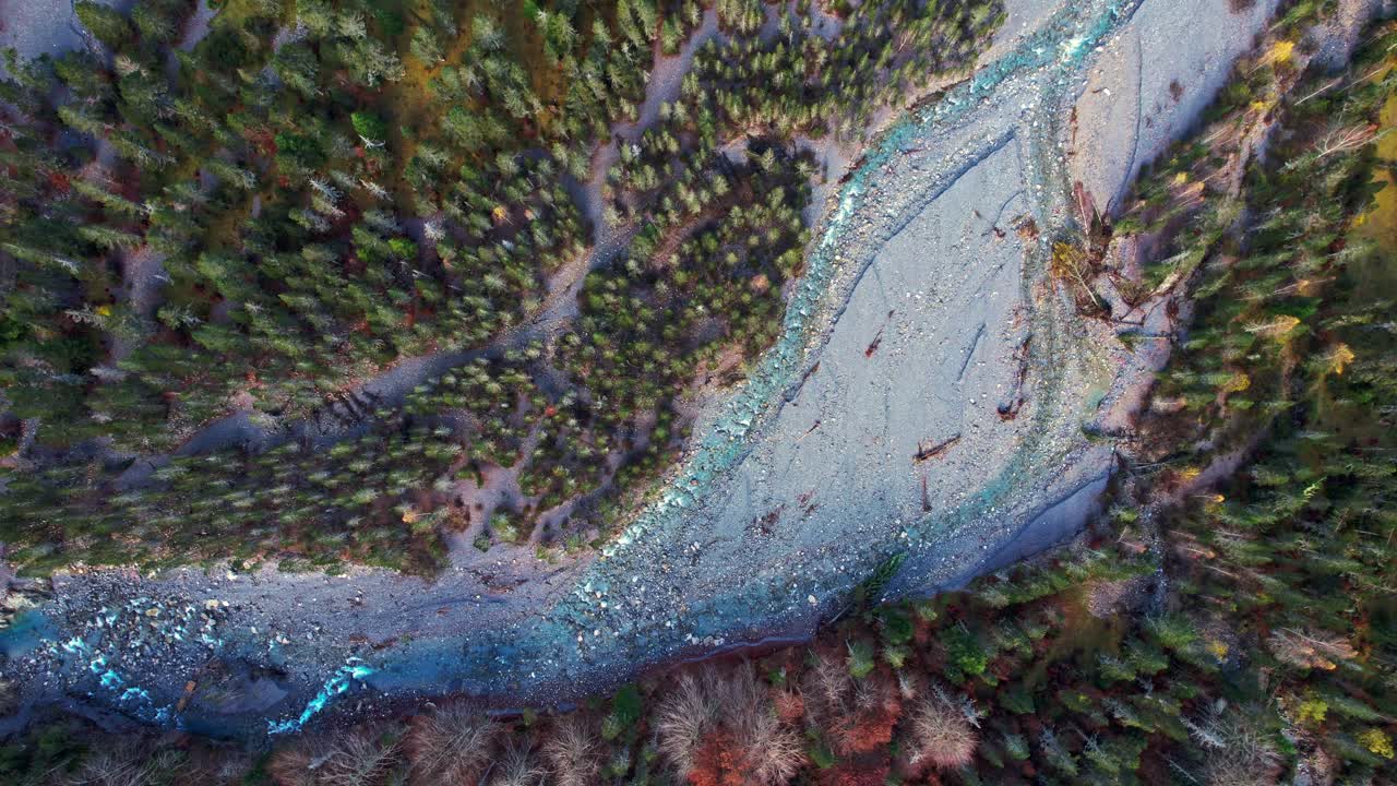 Aerial view of Cirque de Gavarnie valley, lush with trees and flowing stream