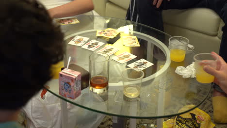 group of unidentifiable asian young people playing cards