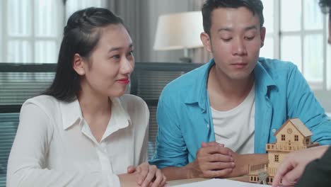 couple meeting with real estate agent