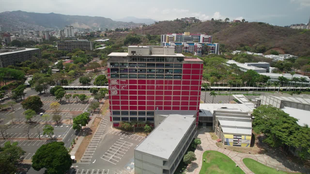Aerial view moving backwards over Central Library, Universidad Central de Venezuela