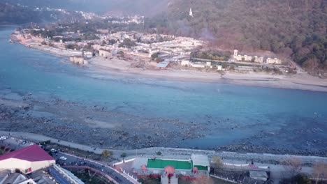 Aerial-View-Of-Ganga-Resort,-Garhwal-Mandal-Vikas-Nigam-At-The-Embankment-Of-Ganges-River-In-Rishikesh,-Uttarakhand,-India