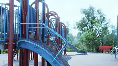 Empty swings on summer kids playground